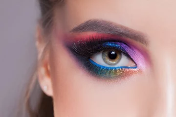 Poster Amazing Bright eye makeup in luxurious blue shades. Pink and blue color, colored eyeshadow © Ulia Koltyrina