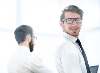 rear view.employees in the workplace.