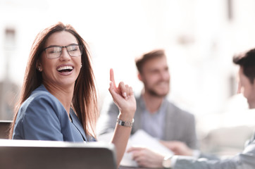 smiling business woman background of colleagues