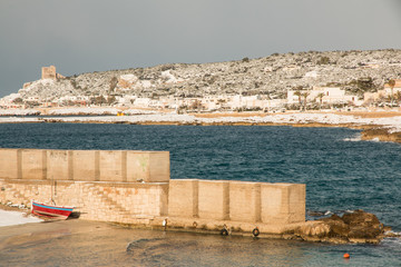 Ionian coast after a exceptional snowfall, Salento, italy