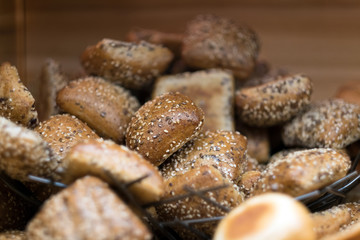 Pile of hot fresh bread bun comparing of whole wheat bun to plain bun for breakfast in the morning.