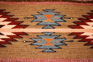 Southwest design on a woven wool carpet