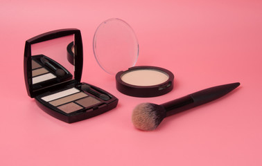 eyeshadow powder with brush matte color palette for makeup on pink background