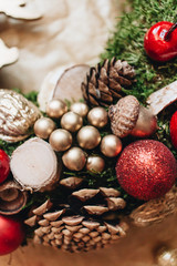 Christmas wreath with pine cones and red balls, festive decoration