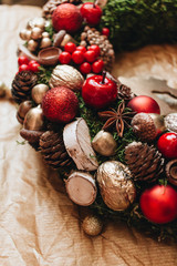 Christmas wreath with pine cones and red balls, festive decoration