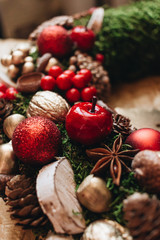 Christmas wreath with pine cones and red balls, festive decoration