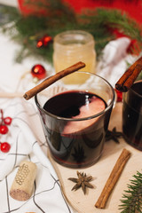 Hot mulled wine and Christmas decoration on table