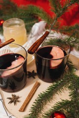 Hot mulled wine and Christmas decoration on table