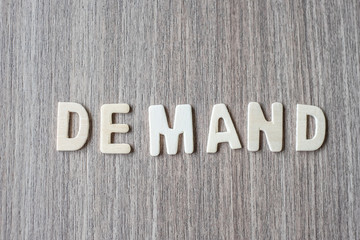 Fototapeta premium DEMAND word of wooden alphabet letters. Business and Idea concept