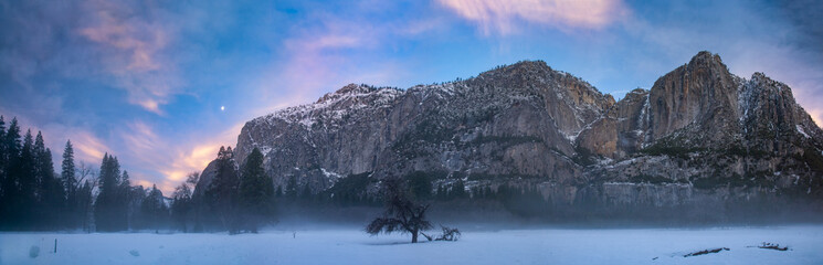 Yosemite at dawn with moon, clouds and thin fog