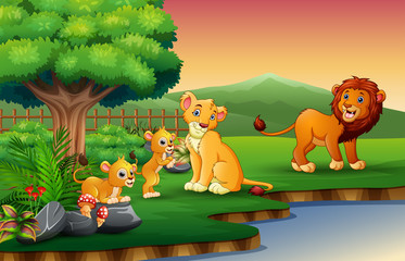 Obraz na płótnie Canvas Lion family cartoon are enjoying nature by the river