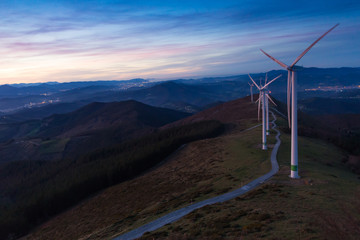 Dusk on Mount Oiz, Basque Country, with wind energy gathering © AnderArrieta