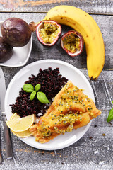 Traditional madeira dish - scabbardfish with bananas and passion fruit
