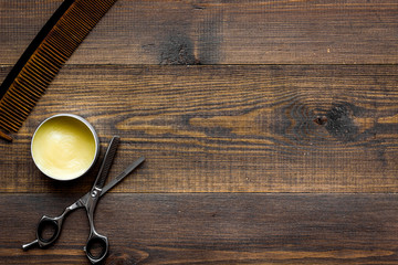 Instruments of male hairdresser barbershop top view on wooden background copyspace