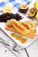 Traditional madeira dish - scabbardfish with bananas and passion fruit