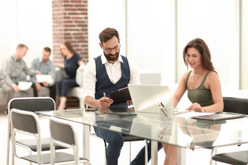 handshake business partners at the office Desk