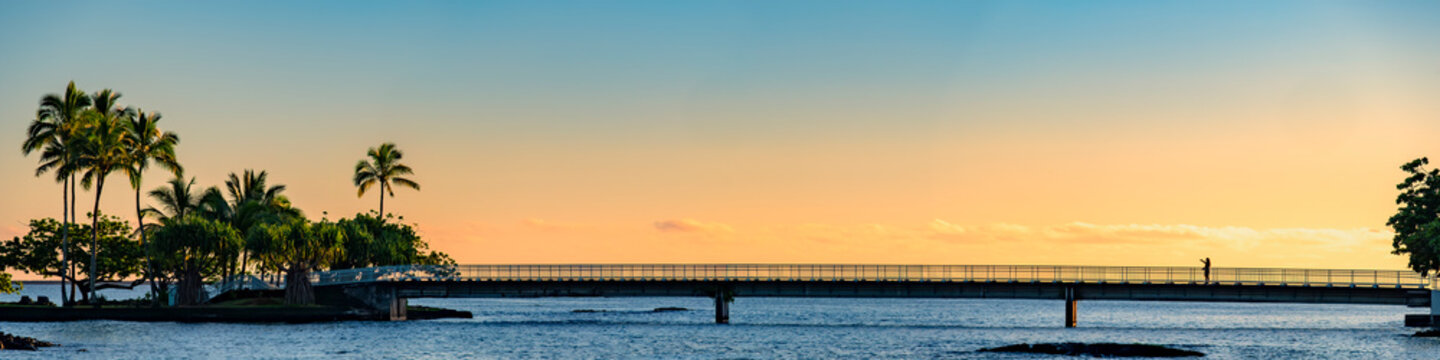 Sunrise Silhouette of the foot bridge at Hilo Bay, Hawaii's Big Island