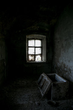 Dark room of abandoned mansion. Opened old chest