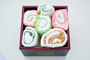 Delicious rolls of Lokum with fruit marmalade in japanese style in black box