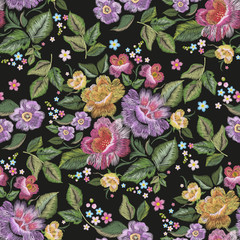 Embroidery floral traditional seamless pattern with pansies and roses. Vector embroidered bouquet with flowers for wearing design.