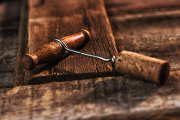 old corkscrew on wood table