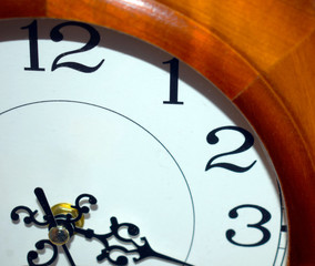 The wall clock shows the time. Minute hand.