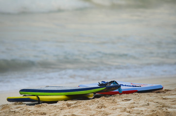 Grouping of 3 boogie boards on Waimanalo Beach in Oahu, Hawaii