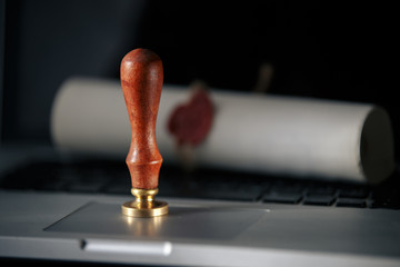Notary public wax stamper and wax seal on document
