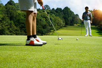 Golfer playing golf in beautiful golf course in the evening golf course with sunshine in thailand