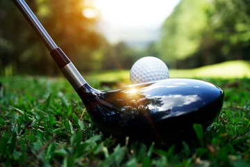 Fotobehang Golf ball and golf club in beautiful golf course with sunset background. Golf ball on green in golf course at Thailand © somchai