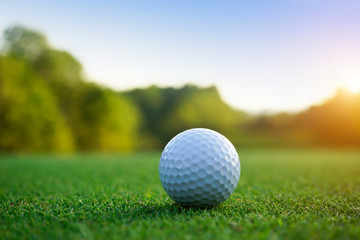 Golf ball on green in beautiful golf course at sunset background. Golf ball on green in golf course at Thailand