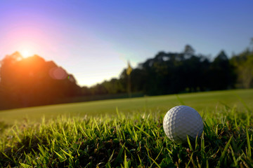 Golf ball on green in beautiful golf course at sunset background. Golf ball on green in golf course at Thailand
