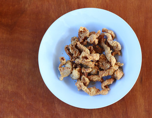 skin of grilled chicken on plate