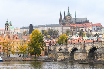 prague river bank and old town at background, czech republic