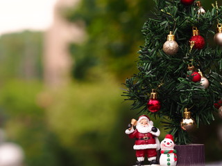 Happy New Year and Christmas concept, Happy new year and Merry Christmas with Bokeh background and blurred background, Santa Claus, Snowman and Christmas tree.