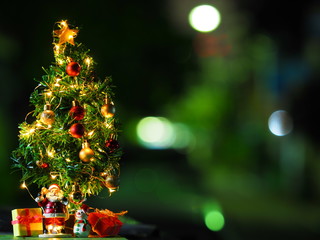 Fototapeta na wymiar Happy New Year and Christmas concept, Happy new year and Merry Christmas with Bokeh background and blurred background, Santa Claus, Snowman and Christmas tree.