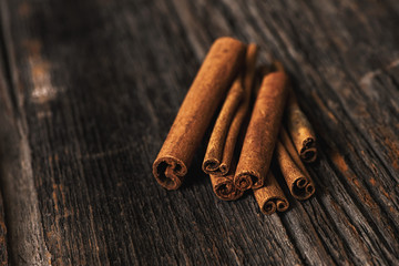 cinnamon sticks on wooden background