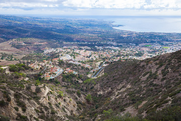 Village and nature. Houses and roofs.  Green shrubs. Travel photo 2018, december.