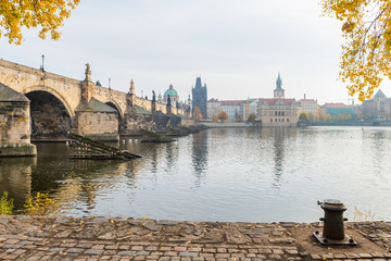 prague river bank and old town at background, czech republic