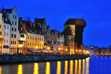Obraz premium Gdansk, Poland, December 2017. Old Historical Crane (Zuraw) on Weltawa River in Gdansk. Old Gdansk architecture.