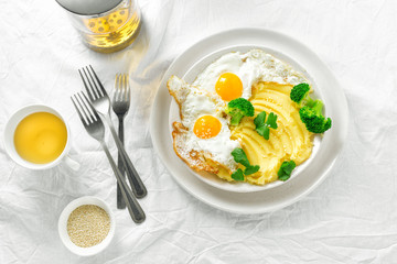 Top view healthy breakfast lunch mashed potatoes fried eggs broccoli tea