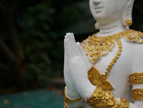 Close up of Thepanom's hands - an angel or deity who is a temple protector and guardian