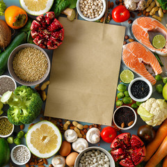 Paper bag healthy food cereals seeds fish vegetables fruits Top view Flat lay