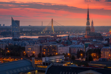 Beautiful aerial panorama of Riga center and Vansu bridge over Daugava river during amazing sunset....