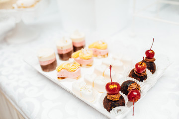 Table with different sweets for party. Candy bar. 