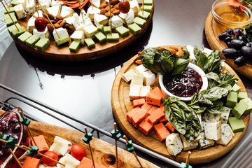 Tasting cheese dish . Delicious cheese on the table. Table setti