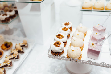 Table with different sweets for party. Candy bar. 