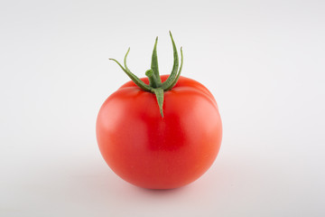 Tomato isolated on white background. With clipping path. Full depth of field.