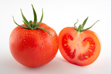 Tomato isolated on white. Tomato with drops. Full depth of field.