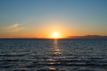 Seascape with beautiful sunset and sunset on the horizon.